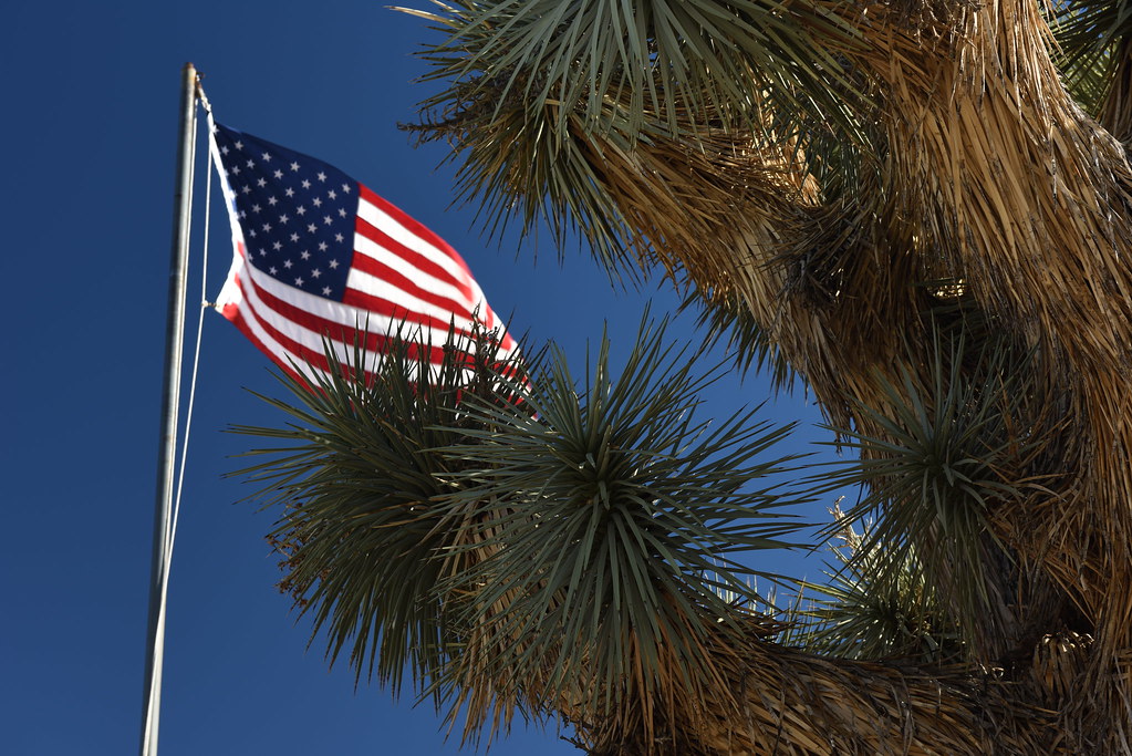 American flag flying against a blue sky